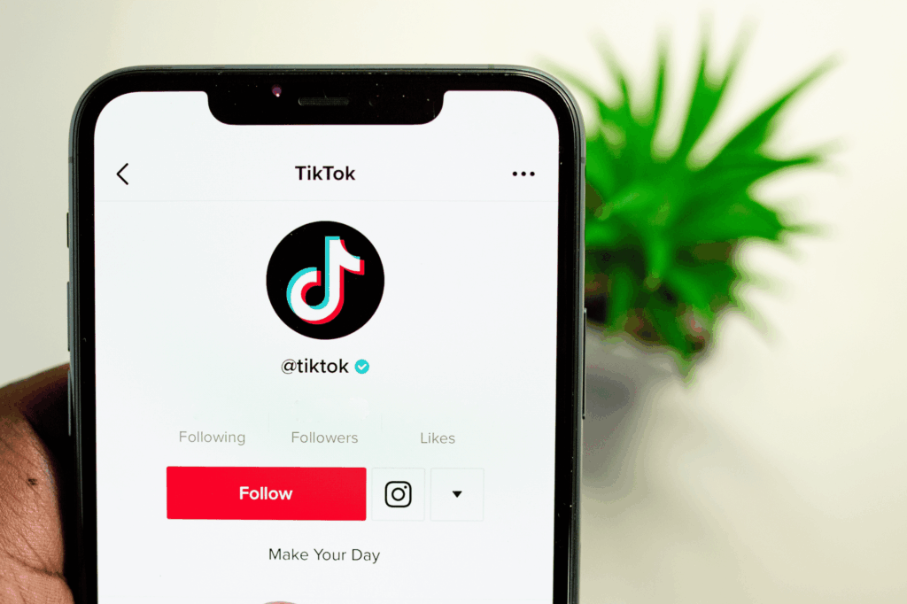 A close-up photo of a phone in the TikTok app looking to grow their business